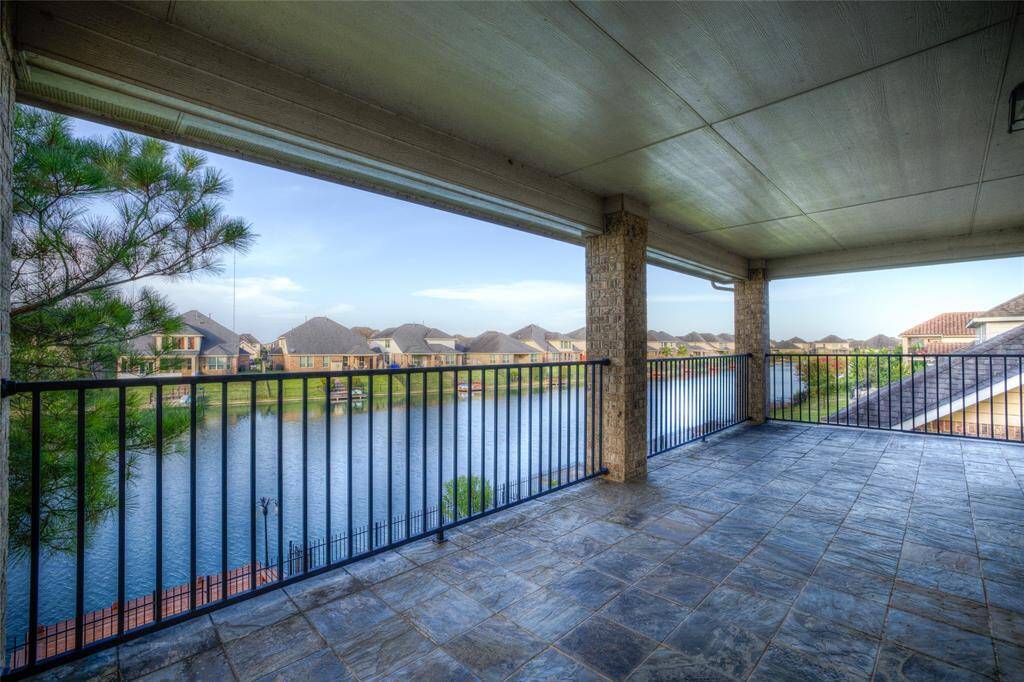 Upstairs balcony is large enough to have a full size outdoor living room set.