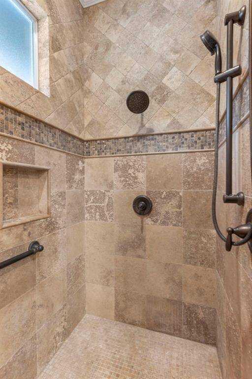 Large custom walk-in shower located on the other side of the primary bathroom.