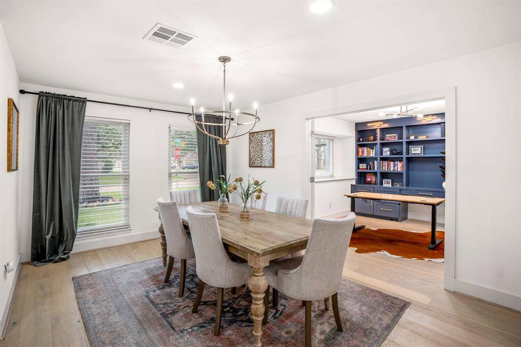 Make memories gathered around the table with your family and friends! This dining room features a beautiful chandelier, large windows, recessed lighting, and oak wood floors