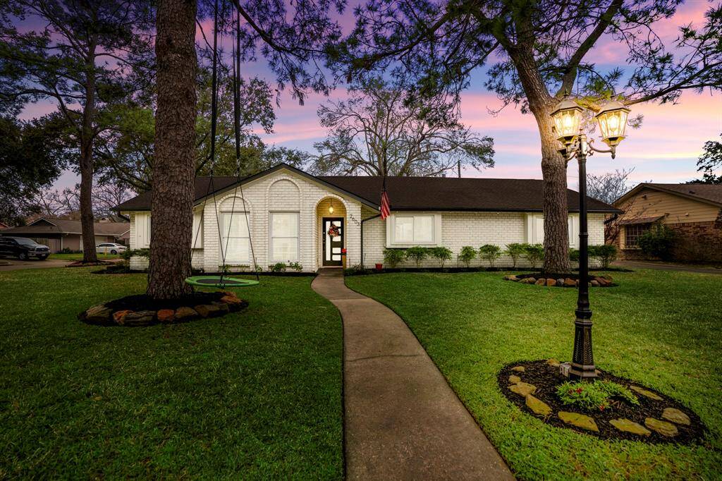 Welcome home! This stunning 1 story home was meticulously renovated in 2022 and greets you with white painted brickand contrasting trim, sensational cub appeal, and lush landscaping!