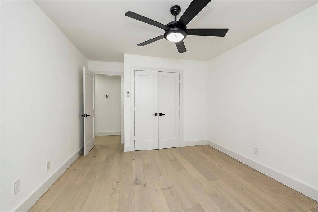 The final room is completed with oak floors, a spacious closet, and above ceiling fan.