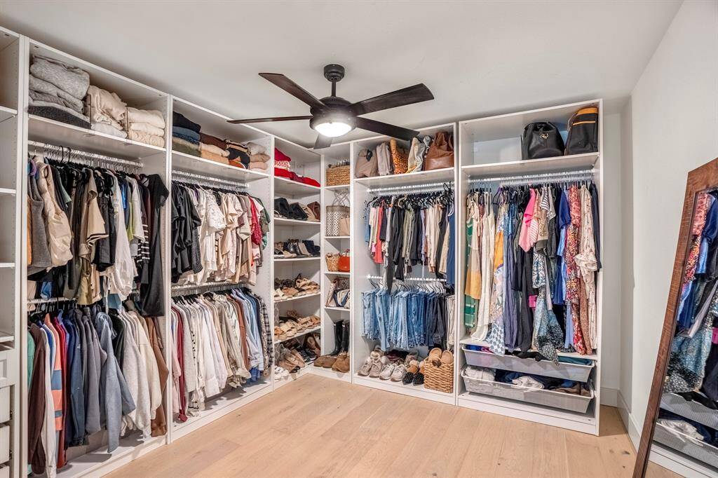 The final room is currently being used as a walk-in closet complete with built-in shelves and plenty of storage.