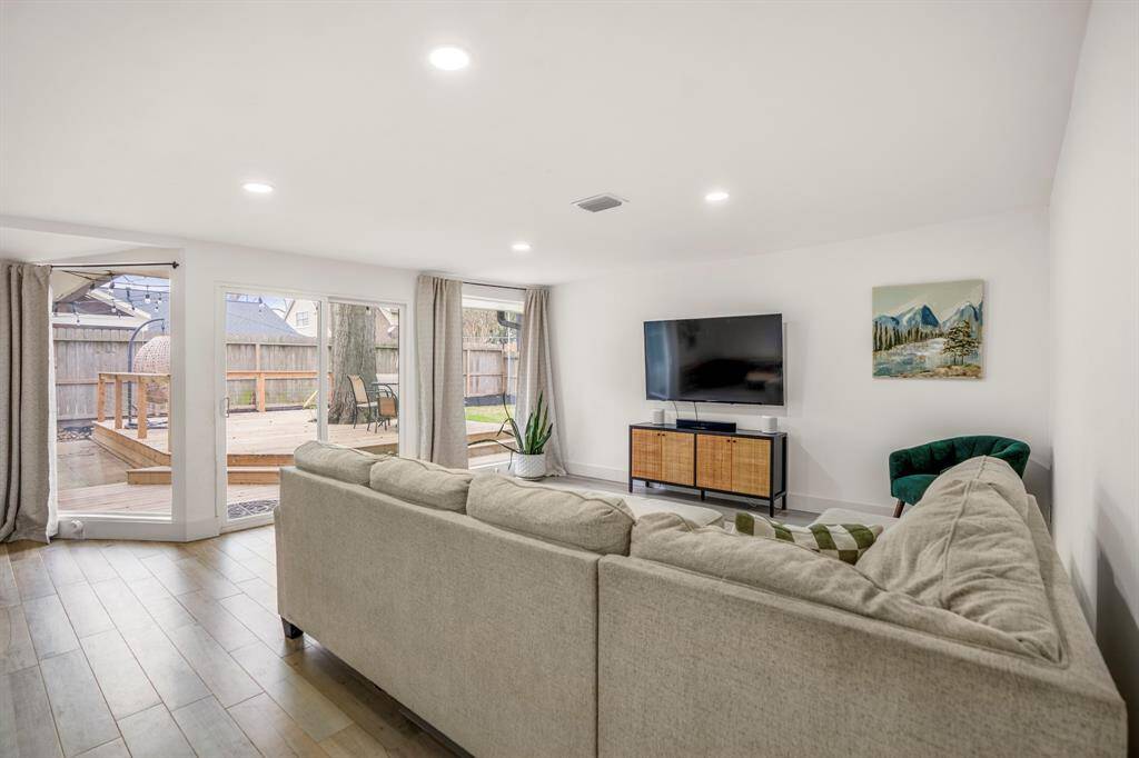 The game room connects to the amazing backyard and custom deck!