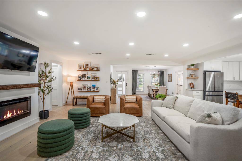 The open concept living room, dining, and kitchen makes for a great way to keep the party going and never miss a beat!