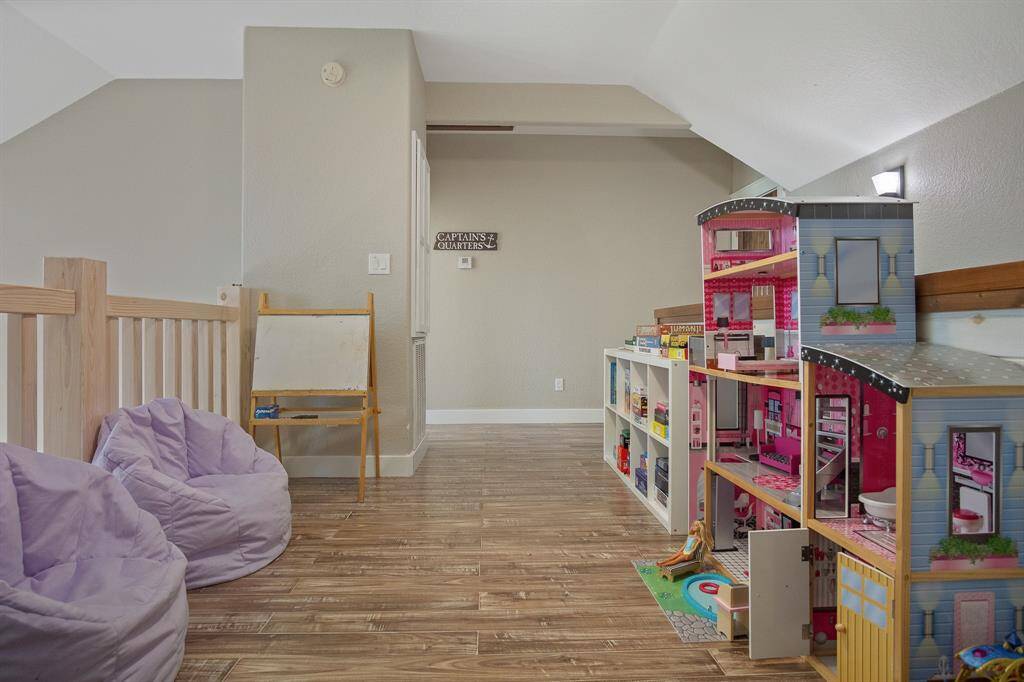 This  cozy loft area offers flexibility for a play area or office space.