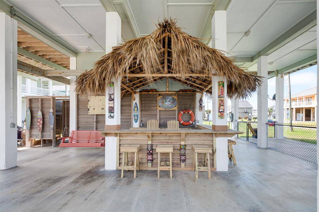 Charming tiki bar on the shaded ground floor, perfect for entertaining and relaxation.
