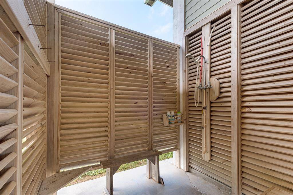 Ground floor outdoor shower offers convenience and privacy.