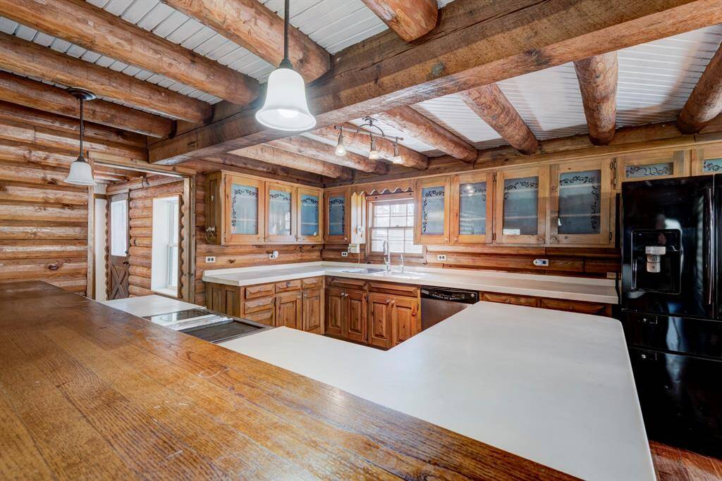 Another shot of the kitchen. The window provides a view of the front fenced in area of the home.