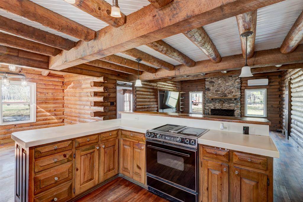 Breakfast area/dining area is to the left of the kitchen.  Kitchen is open to the family room that has a stone wood burning fire place.