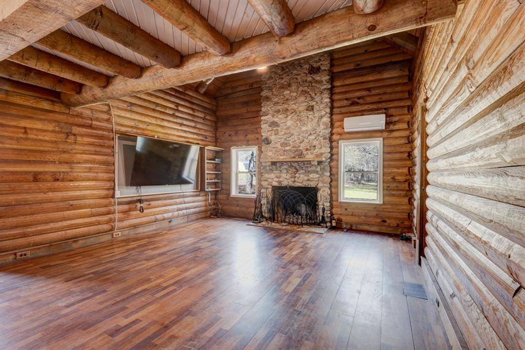 Living room has a view to the back yard of the property.