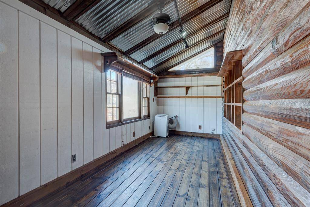 Office area is right off the living area and provides a view of the side of the property.
