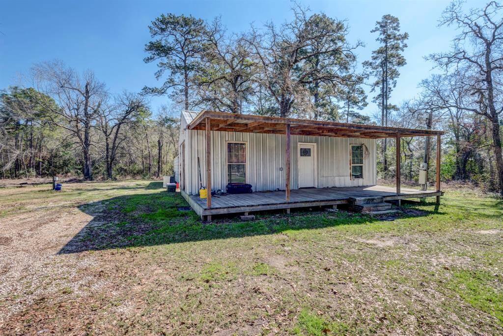 Guest home offers 2 bedrooms and 1 bath and a makeshift kitchen area.  It will require a septic system to operate to its fullest potential.