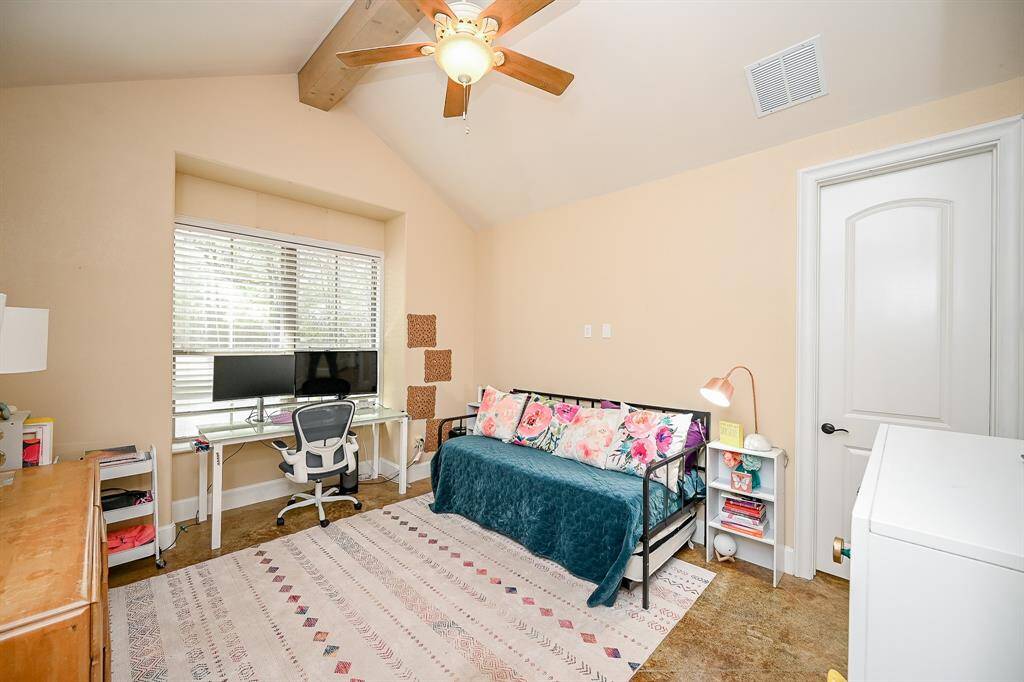 The primary living area features a second, large bedroom.  Painted concrete flooring, a large dual window offering plenty of natural light, plantation-style blinds, vaulted ceiling, ceiling fan and smoke detector are features.  Direct access to a separate bathroom is an attractive feature.