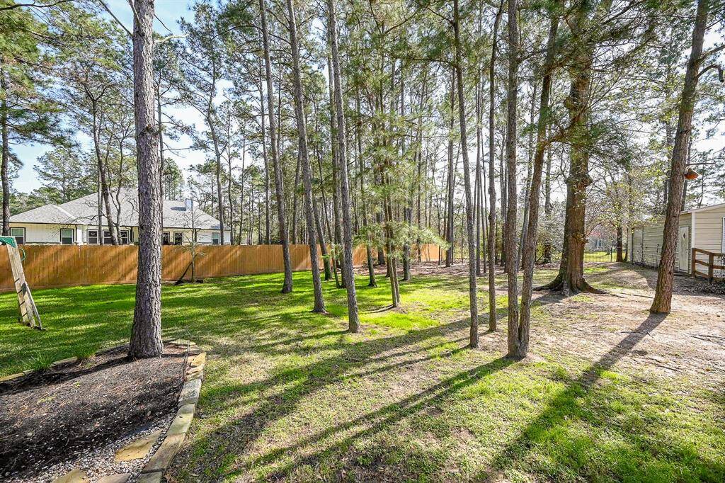 A feature of this property is the absolutely large fenced back yard.  Mature trees, fully fenced, and plenty of natural shade make outdoor gatherings and activities available year round.