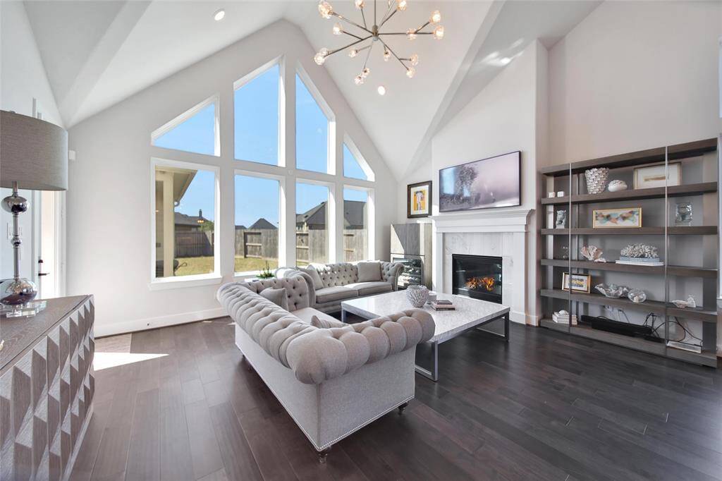 The Living room chandelier also commands attention as a stunning focal point of the room.