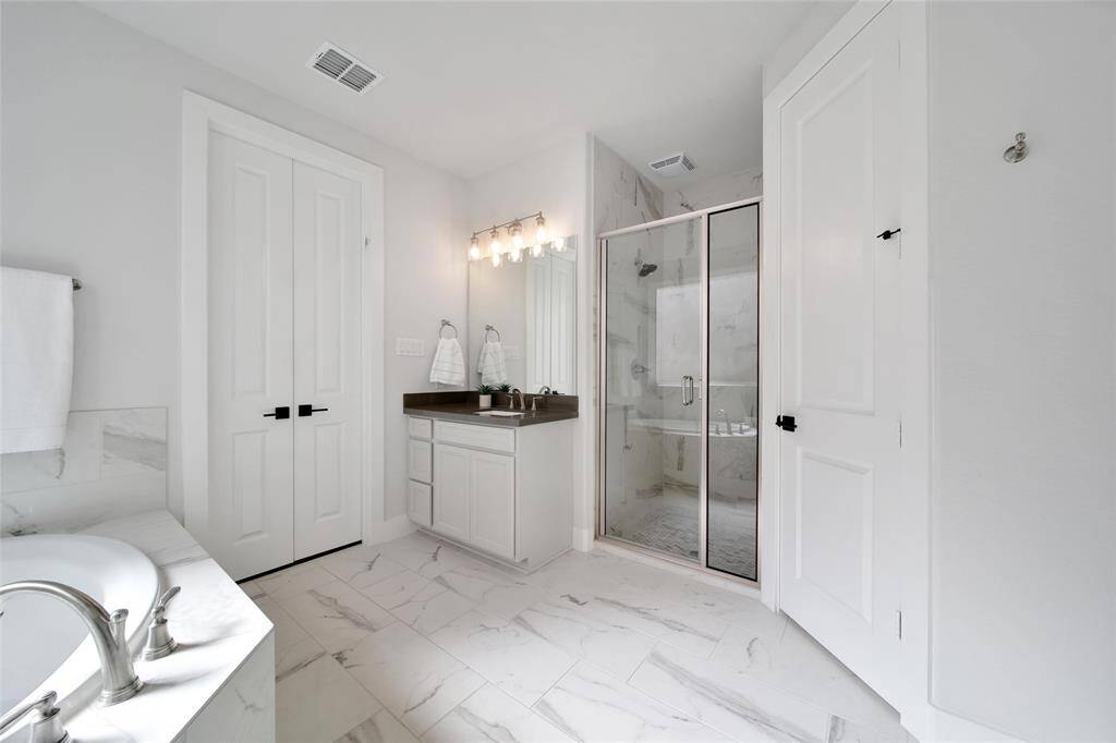 Soothe away your worries in either the soaking tub or walk in shower.