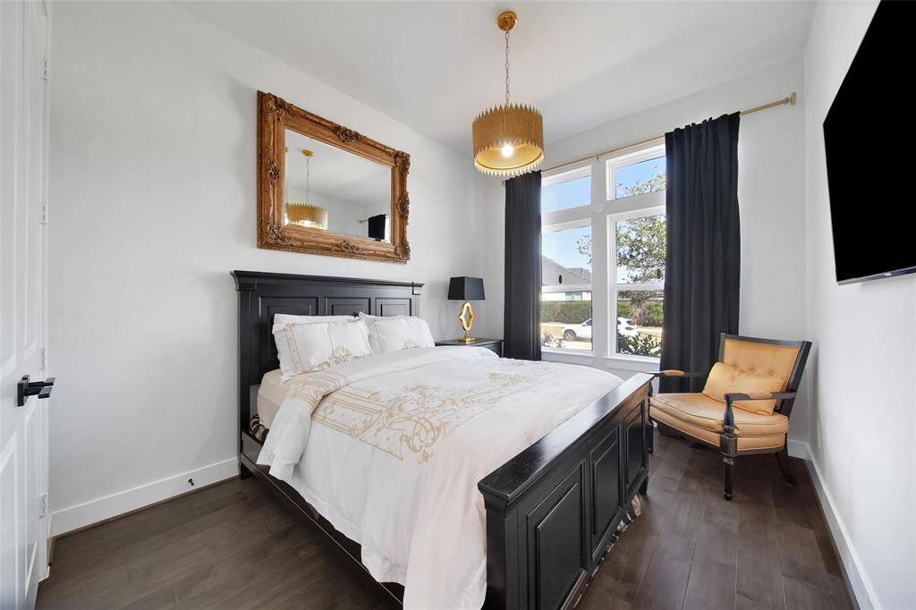 This functional space can serve as a 2nd Bedroom DOWN (has a closet) or an home office. The room boasts another gorgeous designer light fixture!