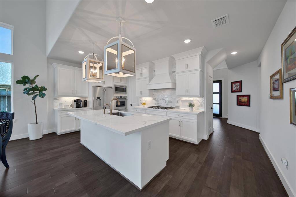 Rich wood floors warm almost the entire 1st floor!