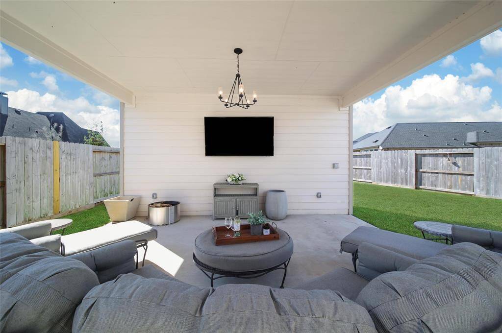 Outdoor Living at its finest! Just imagine relaxing with a glass of wine as the sun sets each evening...or if you prefer additonal company, invite your neighbors over to watch a little baseball and cheer on the Astros!