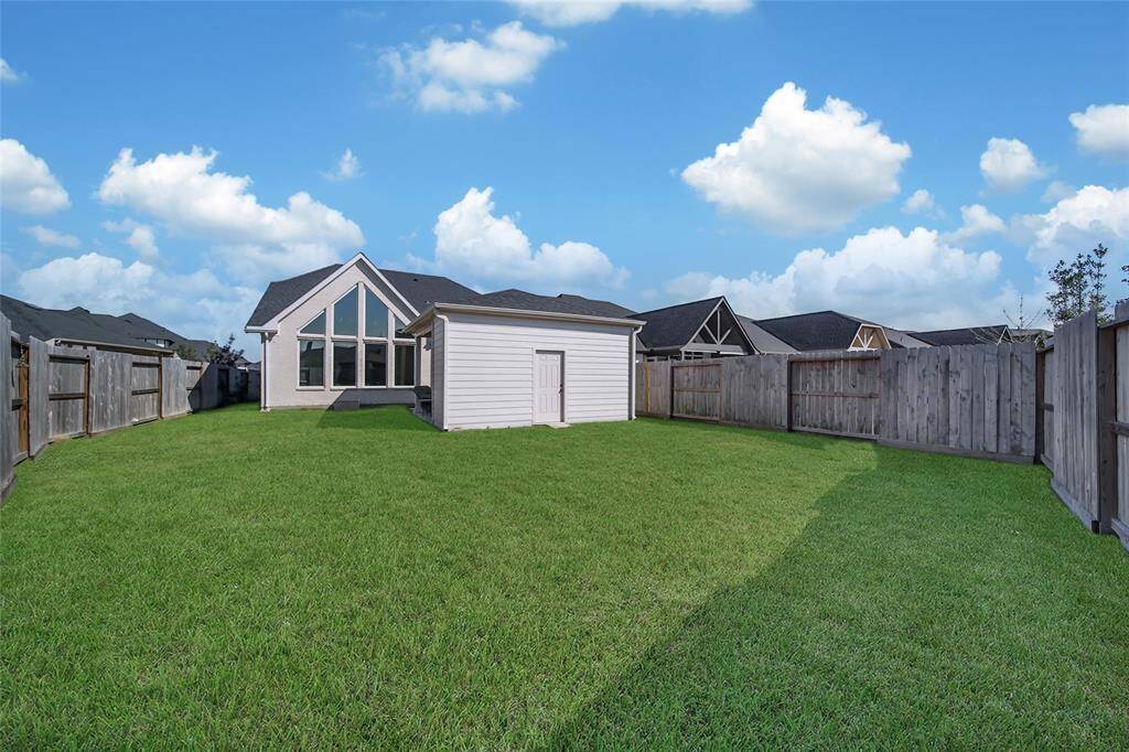 WOW!! Here are 2 surprises: Behind the Patio you will find a built in storage shed running across the back to keep your lawn mower, garden supplies...anything! Second...look at all the space left over. Plenty of room to add a trampoline, play structure, maybe even a pool! (please note the grass color has been photoshopped).