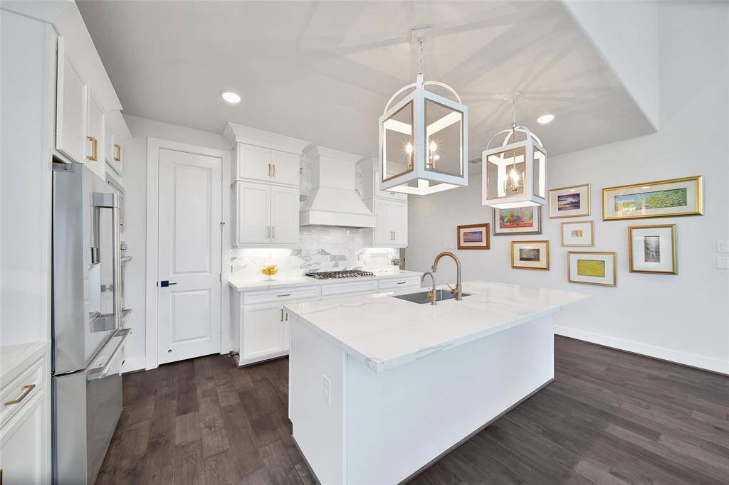 Abundant counter top and cabinet space throughout including a convenient double pot and pan drawer under cook top plus pull out shelves on many lower cabinets.