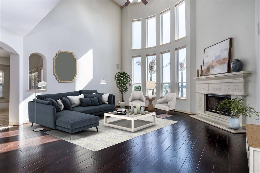 Spacious living room(virtually staged) overlooking the pool and view of the lake