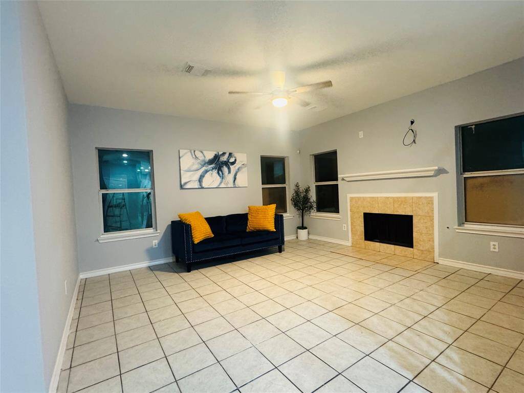 Cozy living room featuring a charming fireplace.