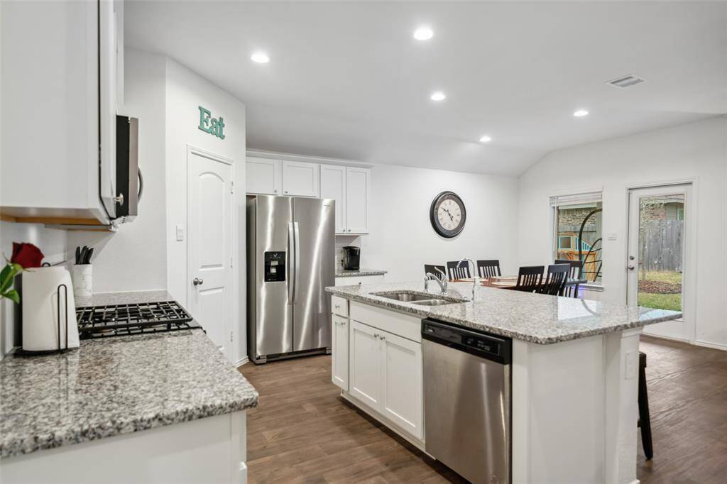 Kitchen & dining area faces the backyard.
