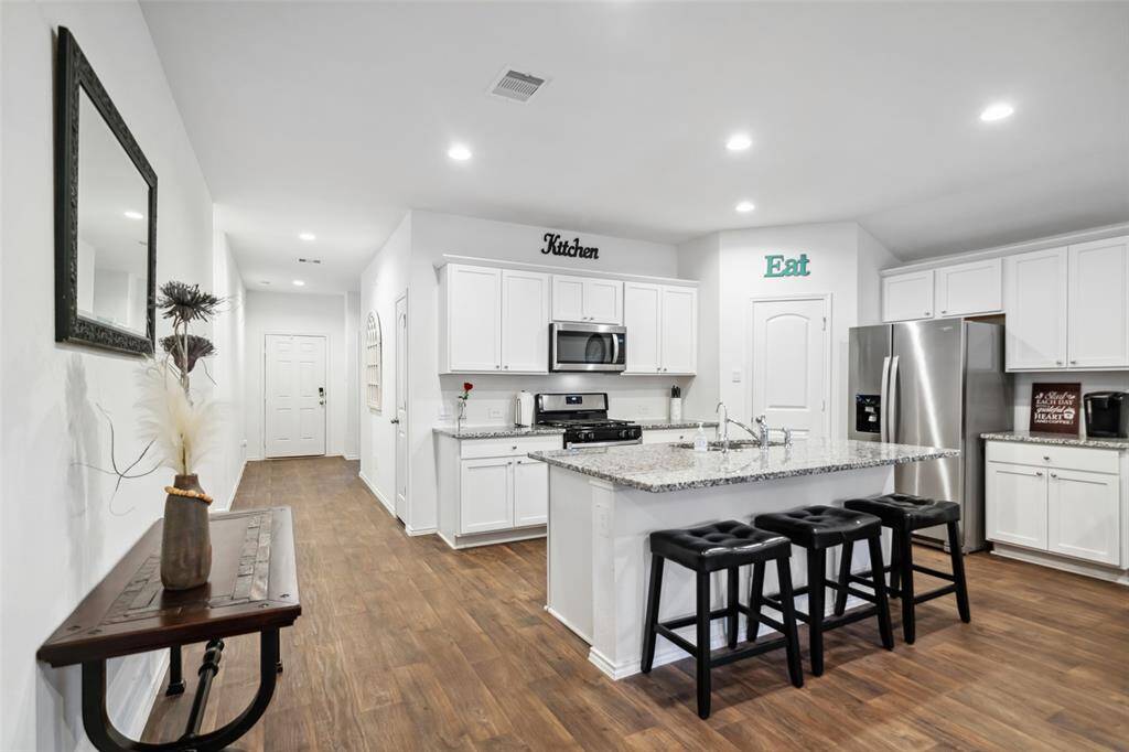 Open concept living and dining areas.