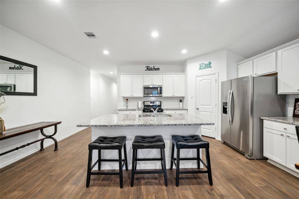 Enjoy the counter height breakfast bar with 3 bar stools.