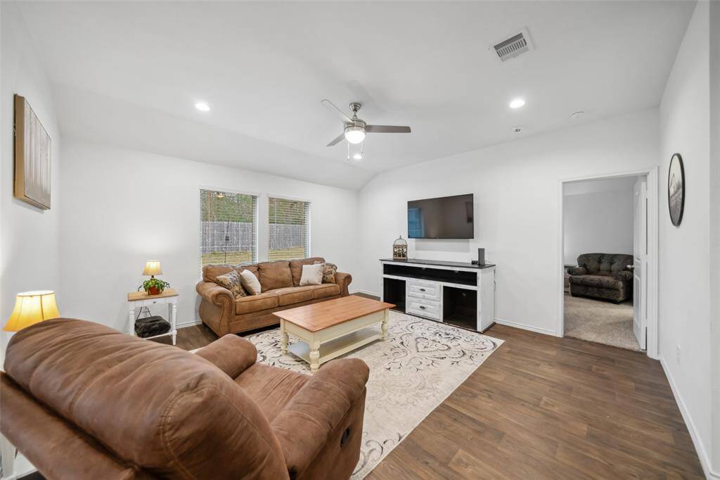 TV can be seen from the kitchen and dining area.