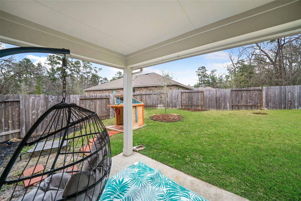 Enjoy the covered patio.(*Chair & playset not included.)