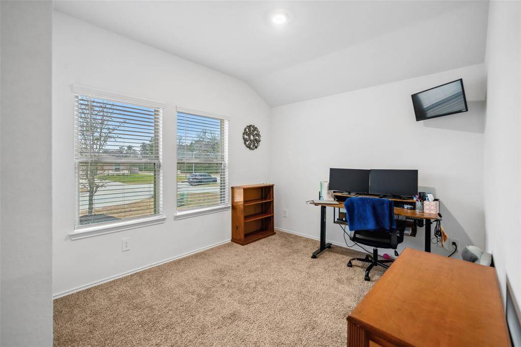 Front bedroom has nice view and is being utilized as a home office.