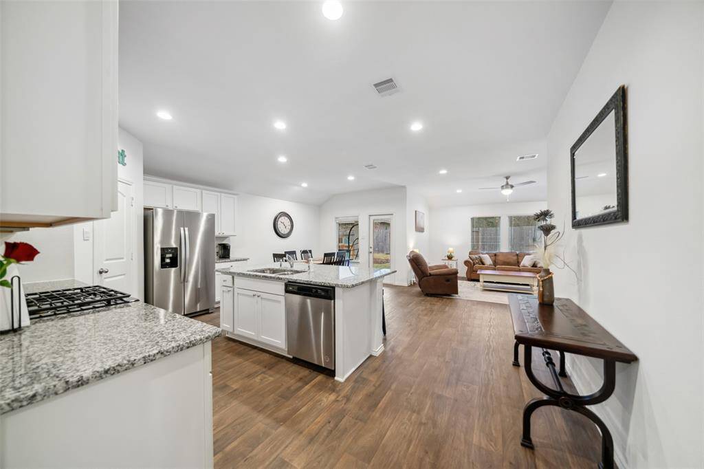 Entry into lovely kitchen, dining & family room areas.