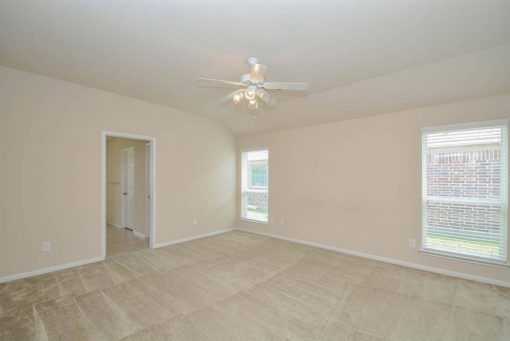 The large master suite with high ceilings is truly fit for a king and queen with great natural lighting.