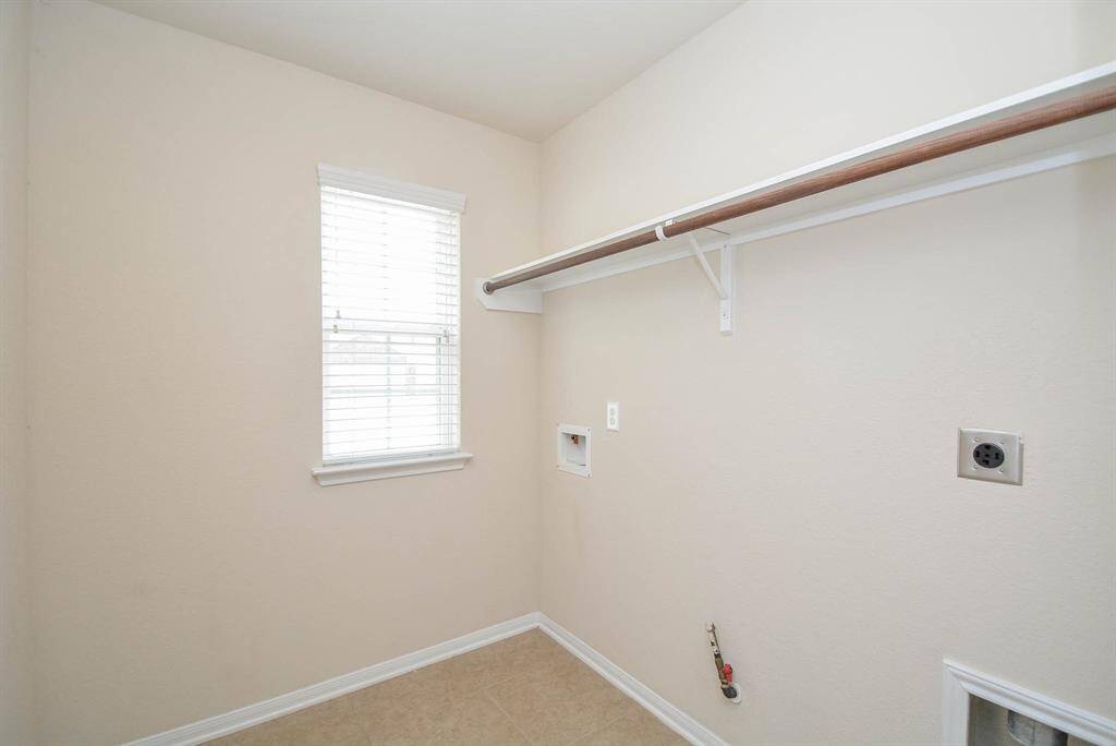Indoor utility room with gas and electric connections available.