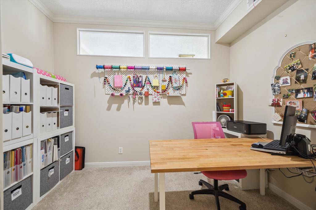 Owner has created this office space that can be closed off with sliding glass doors.
