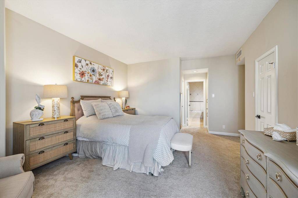 Primary bath. Double sinks, separate shower and tub. Water closet for added privacy.