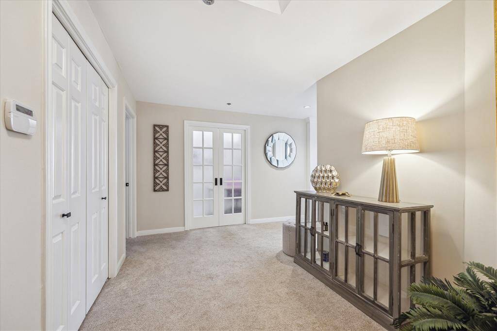 Large formal entry hall with guest closet.