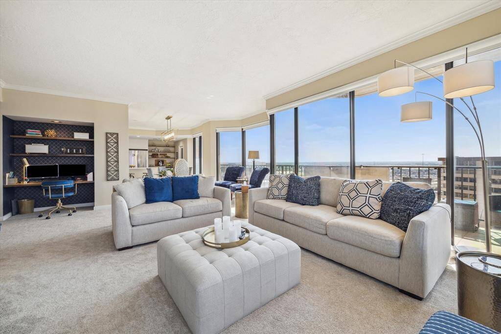 This view of the living room is looking towards the dining room and additional sitting area