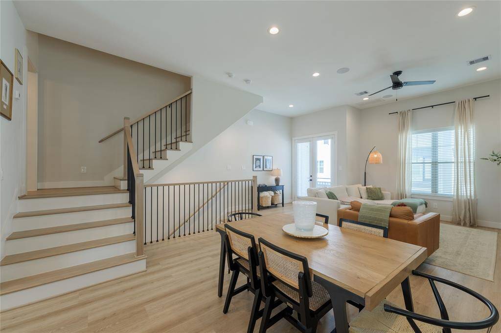 Open floor plan. Half bath is located on left on the landing of the stairs.