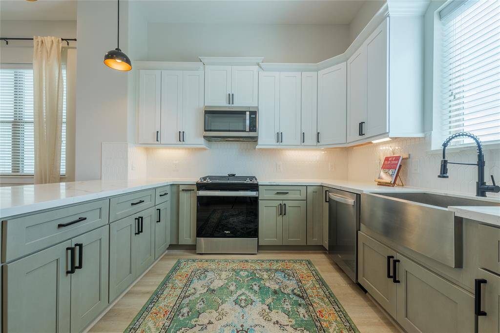 Beautiful cabinetry and stainless steel appliances.