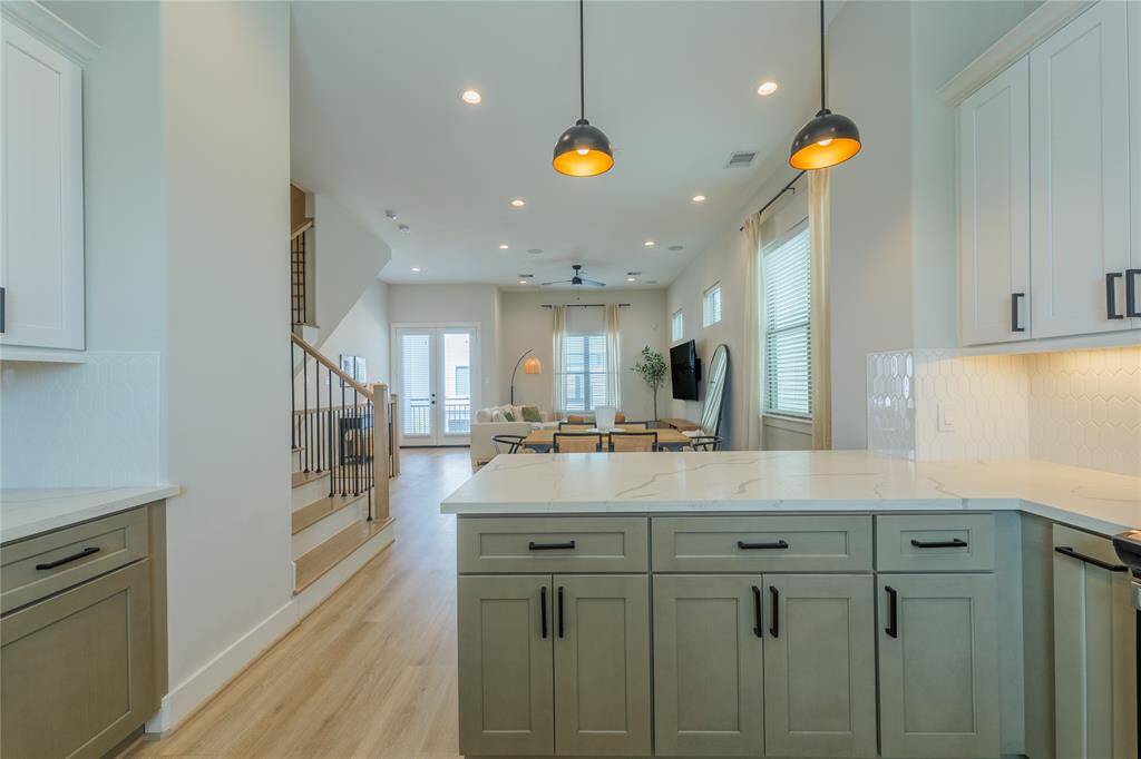Kitchen is open to dining and living room.
