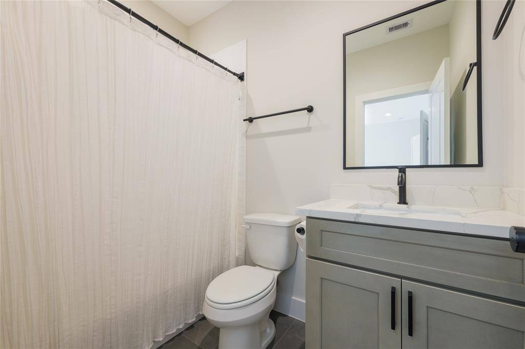 Ensuite bathroom for guest bedroom on first floor.