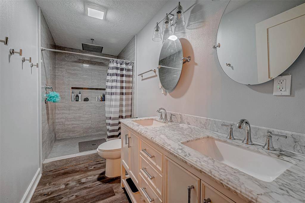 Primary bathroom features a walk in shower