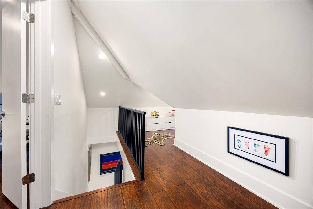 Upstairs you'll find two distinct spaces—a spacious and private bedroom with ample room to unwind, and a tucked-away flex space just off the stairs.