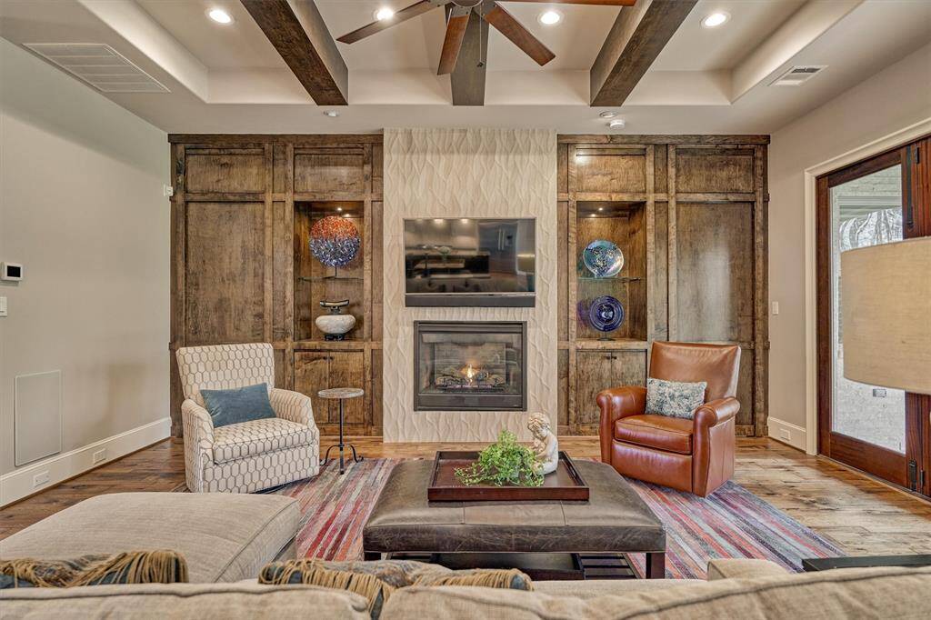Two (2) Murphy doors on each side of fireplace. Left side to Powder Bath. Right side to Primary suite.