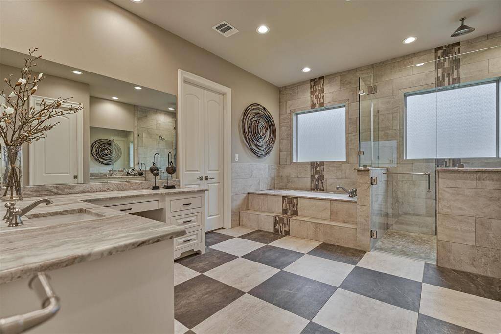 Spa inspired Primary Bath with separate sink areas, large tub and separate shower.
