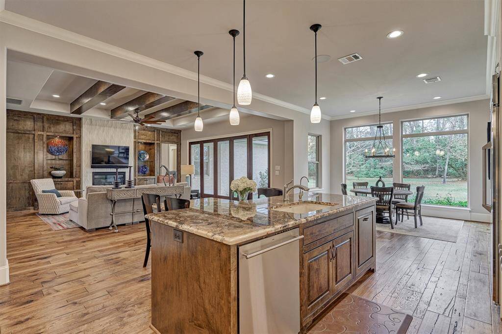 Kitchen island with sink, dishwasher and trash drawer. Great for entertaining.
