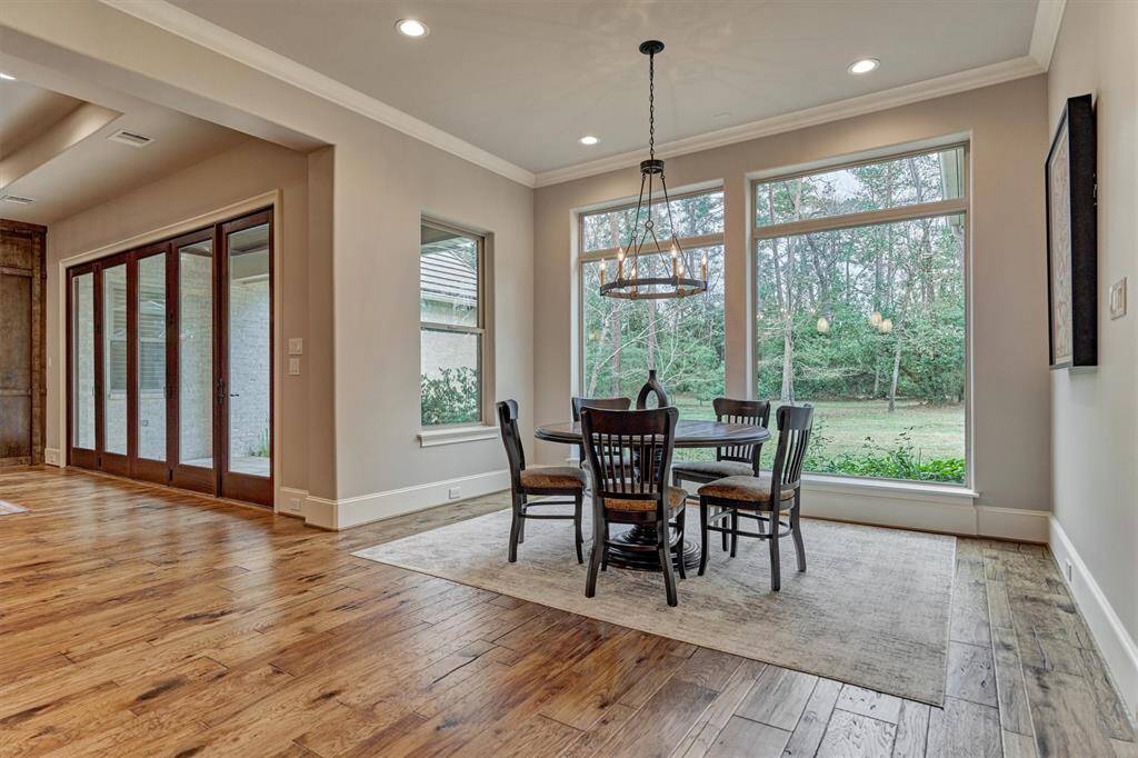 Dining space large enough for family, cozy enough for intimate conversation. Large windows provide atural light and outdoor beauty.
